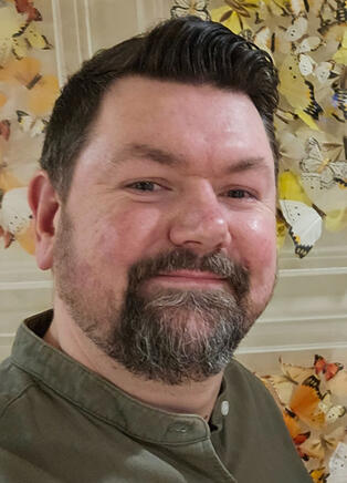 Search Beef Logo A headshot of Search Beef podcast host Joss Froggatt